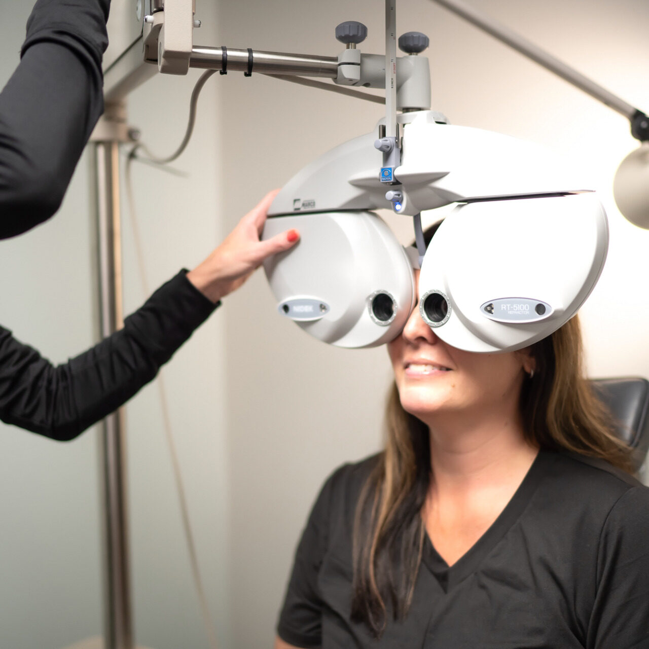 Dr. Becky runs a routine eye exam on young woman