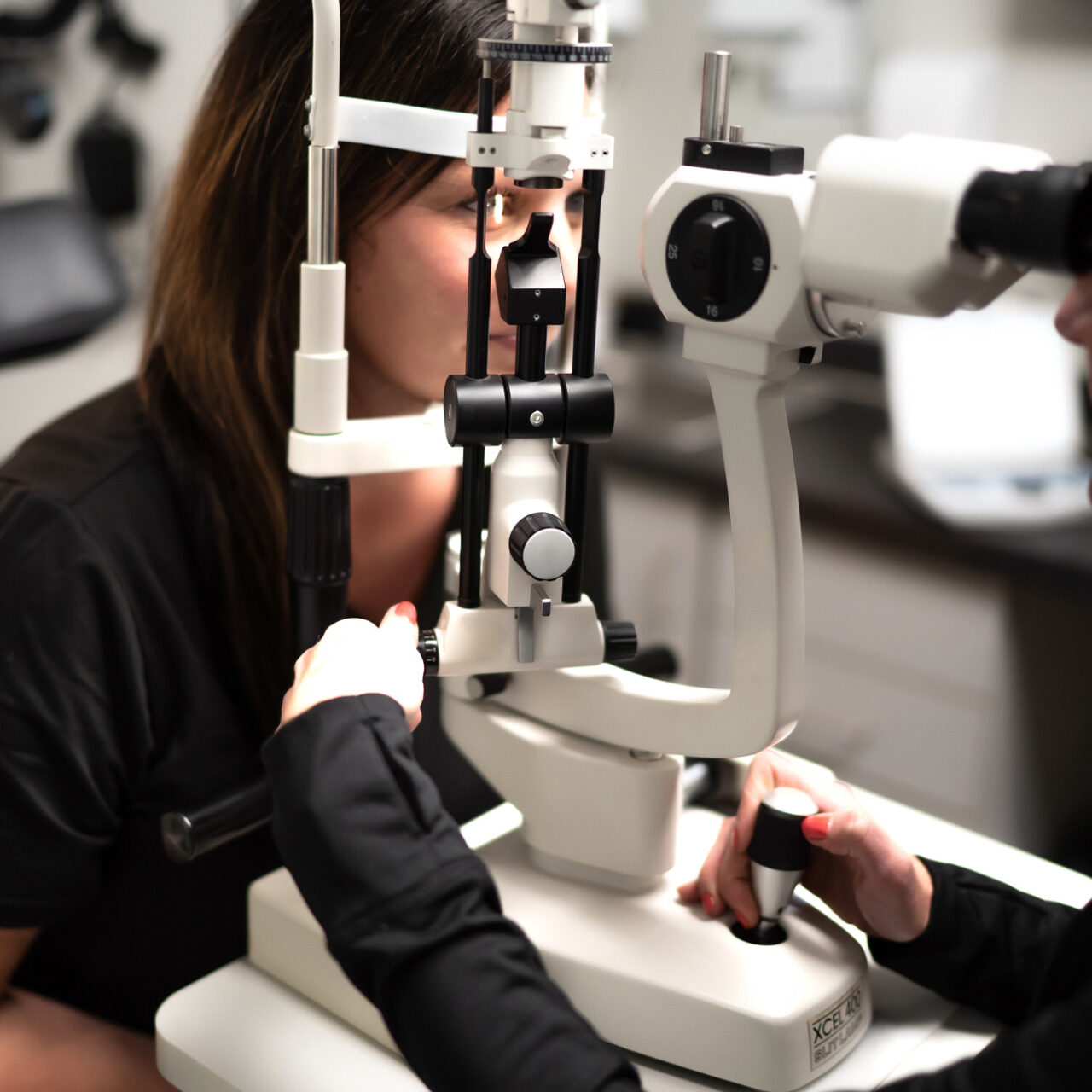 Dr. Becky runs a routine eye exam on woman